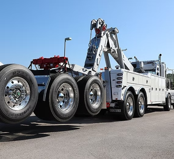Heavy-duty tow truck with shiny wheels